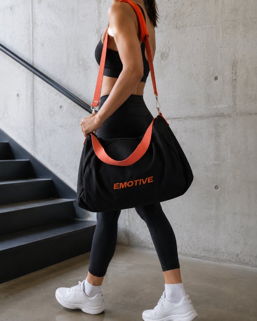 Woman carrying an Emotive gym bag